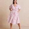 The Coastal Poplin Puff-Sleeve Wrap Midi Dress - Batik Floral In Faded Rose & White Sand 1 The Coastal Poplin Puff-Sleeve Wrap Midi Dress - Batik Floral In Faded Rose & White Sand -Summersalt Shop CoastalPoplinPuff SleeveWrapMidiDress BatikFloralinFadedRose WhiteSand Front Full